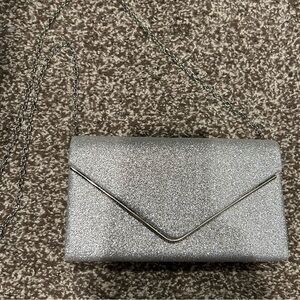 Sparkly silver purse in new condition. With silver chain strap